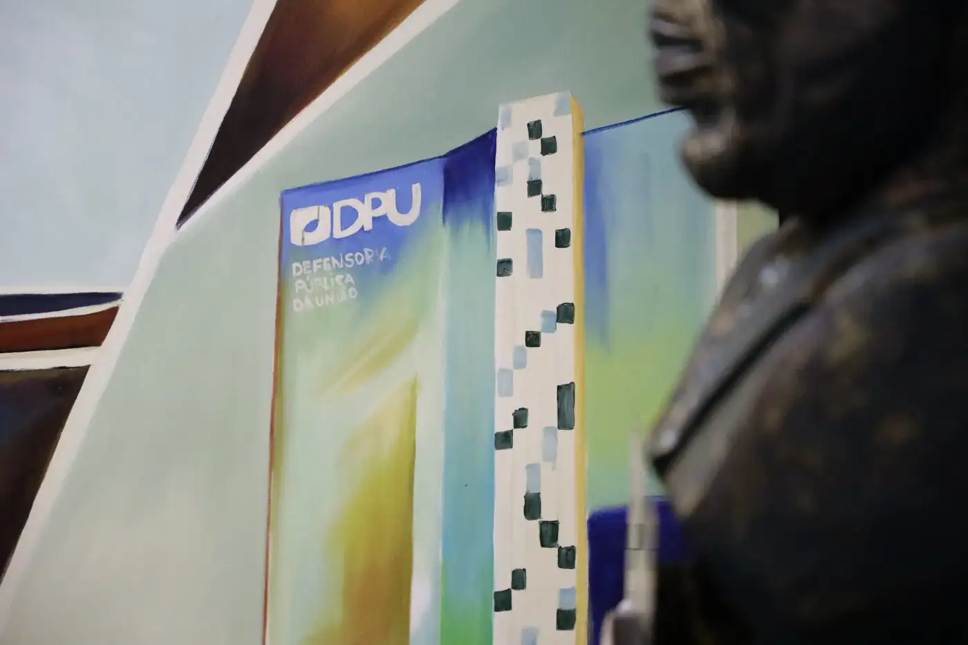 Detalhe da representação da Defensoria Pública da União no painel do Salão Nobre Kofi Annan